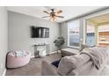 Cozy living room featuring a sectional sofa and a large TV at 9911 New Parke Rd, Tampa, FL 33626