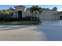 Stunning two-story home with three-car garage and manicured landscaping at 10626 Restoration Ter, Bradenton, FL 34212