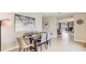 Open concept dining room with view into the kitchen and living room at 12016 Lansing Gln, Parrish, FL 34219