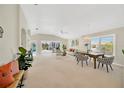 Spacious living area with open floor plan and access to pool area at 2357 Emerald Lake Dr, Sun City Center, FL 33573