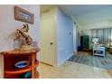 Entryway with decorative table and accents at 3000 Red Oak Court # 103, Palm Harbor, FL 34684