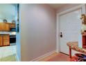 Bright and airy entryway with tiled floor at 3000 Red Oak Court # 103, Palm Harbor, FL 34684