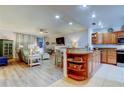 Open living space with kitchen and seating area at 3000 Red Oak Court # 103, Palm Harbor, FL 34684