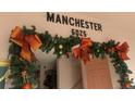 Decorated condo entry with festive garland at 6025 Shore S Blvd # 405, Gulfport, FL 33707