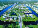Community overview showcasing waterfront properties and lush landscaping at 8610 Quinn Ct, North Port, FL 34287