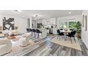Modern kitchen featuring stainless steel appliances and an island at 936 Lyndhurst St, Dunedin, FL 34698