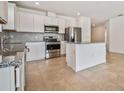 Modern kitchen with stainless steel appliances and granite countertops at 12811 Wanderlust Pl, Parrish, FL 34219