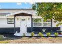 Modern front entrance with white door and black accents at 177 Dowling Ne Ave, Port Charlotte, FL 33952
