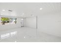 Bright living room with white walls and marble floors at 177 Dowling Ne Ave, Port Charlotte, FL 33952