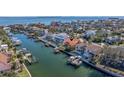 Aerial view of waterfront home with private dock and boat slips at 207 8Th E St, St Petersburg, FL 33715
