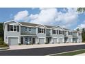 Five-unit townhome building, featuring attached garages and a neutral color scheme at 2758 Pearly Banks Dr, Bradenton, FL 34208