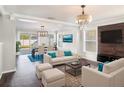 Spacious living room with hardwood floors and modern furniture at 32328 Fish Hook Loop, Wesley Chapel, FL 33545
