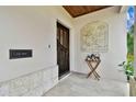 Inviting entryway with a decorative relief and side table at 3314 W Barcelona St, Tampa, FL 33629
