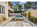 Relaxing pool area with lounge chairs and landscaping at 3314 W Barcelona St, Tampa, FL 33629