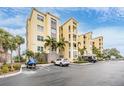 Condo building exterior showcasing its architecture and landscaping at 425 150Th Ave # 2401, Madeira Beach, FL 33708