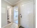 Interior condo entryway with view to living room and bathroom at 4507 S Oak Dr # P71, Tampa, FL 33611