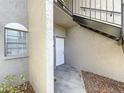 Condo building entryway with white door and exterior stairs at 4507 S Oak Dr # P71, Tampa, FL 33611