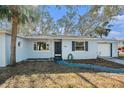 House with a dark-colored front door and a landscaped walkway at 4824 Trade Winds S Dr, Gulfport, FL 33711