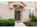 Inviting entryway with dark-green door and well-maintained landscaping at 504 51St N Ave, St Petersburg, FL 33703