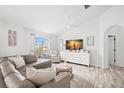 Spacious living room featuring a comfy sectional sofa and large TV at 504 51St N Ave, St Petersburg, FL 33703