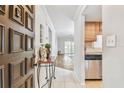 Inviting entryway featuring a decorative front door, tile flooring, and view into the living area at 601 N Hercules Ave # 1003, Clearwater, FL 33765