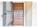 Close-up of the front door, with a decorative design and clear house number above the door at 601 N Hercules Ave # 1003, Clearwater, FL 33765