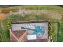 Unique guitar-shaped pool with a spa and screened enclosure at 11910 Climbing Fern Ave, Riverview, FL 33579