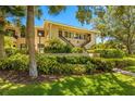 Building exterior showcasing landscaping and entrance at 1812 Mariner Dr # 137, Tarpon Springs, FL 34689