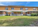 Backyard of the property, showing a grassy area and patios at 2292 Austrian Ln # 22, Clearwater, FL 33763