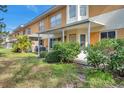 Back view of a building showing individual units, patios, and landscaping at 2292 Austrian Ln # 22, Clearwater, FL 33763