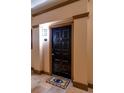 Apartment entry door with tiled floor and decorative mat at 4221 W Spruce St # 1212, Tampa, FL 33607