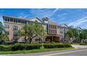 Building exterior showcasing landscaping and gated entrance at 4221 W Spruce St # 1212, Tampa, FL 33607
