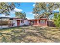 Two-unit house with yard and carport at 5711 S Coolidge Ave, Tampa, FL 33616