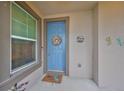 Blue front door featuring a seashell wreath at 6516 Salt Creek Ave, Apollo Beach, FL 33572