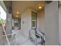 Covered porch with seating for relaxing at 6516 Salt Creek Ave, Apollo Beach, FL 33572