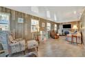 Relaxing living room featuring wood-like walls and comfy seating at 107 W Saint Lucia Loop, Apollo Beach, FL 33572