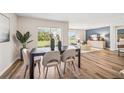 Modern dining room with a dark wood table and six light beige chairs at 11202 40Th E Ave, Palmetto, FL 34221