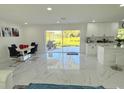 Bright dining area with sliding glass doors leading to a patio at 1210 Sunset Ln, Lutz, FL 33549