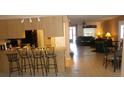 Kitchen with breakfast bar and view into living room at 12172 Wild Acres Rd, Largo, FL 33773