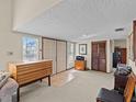 Bright and spacious entryway with tiled floors and wooden furniture at 1614 Sea Breeze Dr, Tarpon Springs, FL 34689
