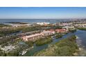 Waterfront community with lush landscaping and a view of the coastline at 1695 Pinellas Bayway S # D1, Tierra Verde, FL 33715