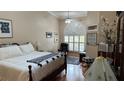 Large main bedroom with an arched window and ample natural light at 1743 Arabian Ln, Palm Harbor, FL 34685