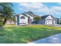 Landscaped lawn and a charming facade enhance this single-story house at 4309 Duncombe Dr, Valrico, FL 33596