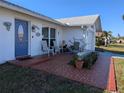 Inviting front porch with tiled flooring and seating area at 4415 Great Lakes N Dr, Clearwater, FL 33762