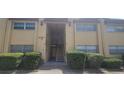 Condo building entrance with stairs and landscaping at 4450 40Th N Ave # D2, St Petersburg, FL 33714