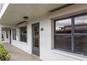 Unit entrance with hallway view and building exterior at 4910 Bay Ne St # 109, St Petersburg, FL 33703