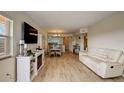 Open concept living area with hardwood floors, dining area and kitchen at 4516 Seagull Dr # 419, New Port Richey, FL 34652