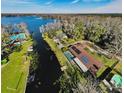 Bird's-eye view of a home showcasing a canal-side location and pool at 4747 Tamney Ln, Land O Lakes, FL 34639