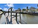 Private boat dock with lift; perfect for water access at 5614 Seagrass Pl, Apollo Beach, FL 33572