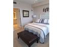 Spacious bedroom with a comfortable bed and a view of the bathroom at 1200 Country Club Dr # 1103, Largo, FL 33771